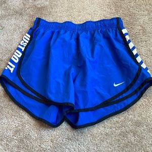 Blue, black, and white Nike shorts